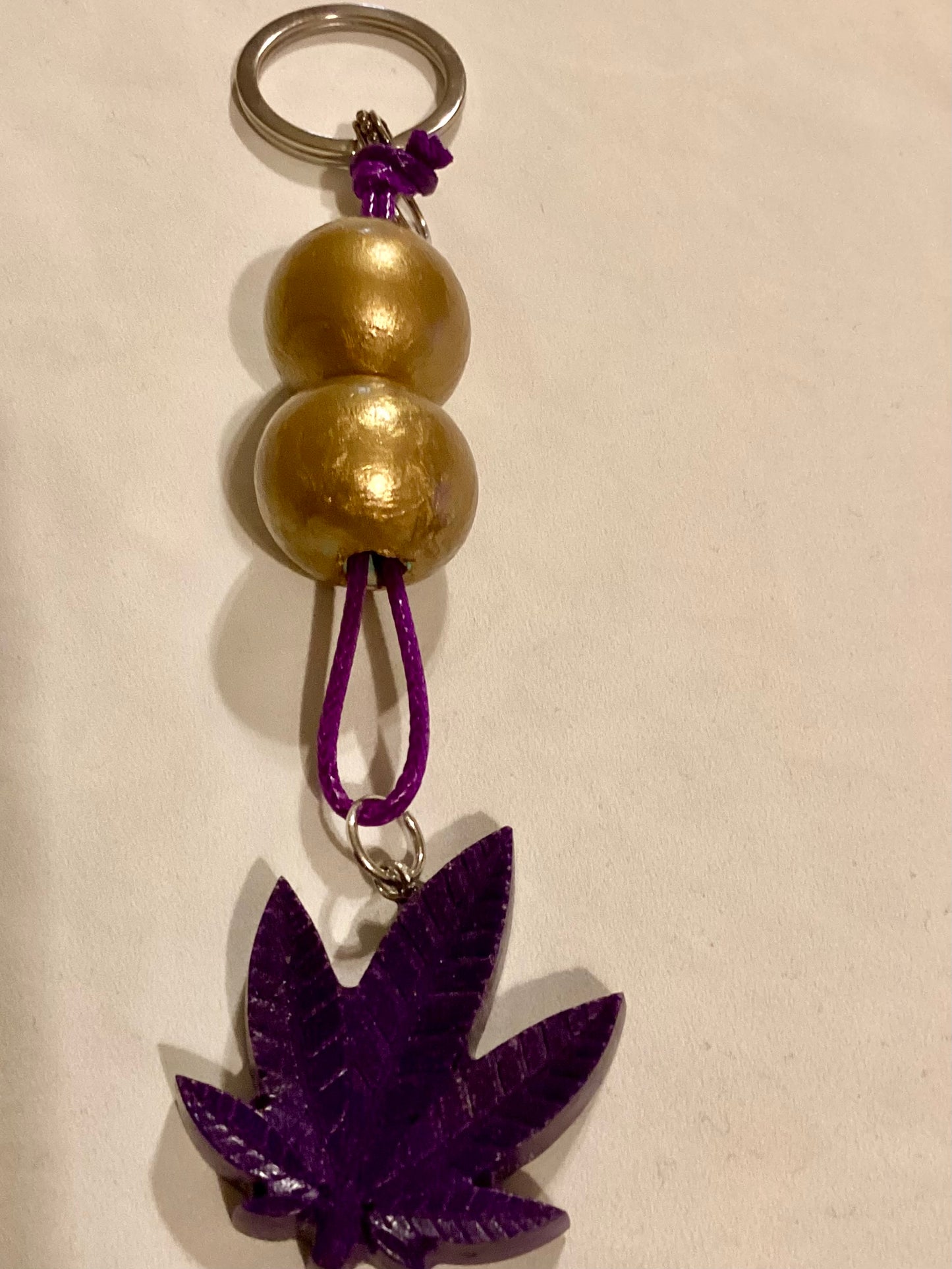 Handmade 1.5” Resin Purple Weed Leaf Medallion & Gold Wood Beaded Key Chain