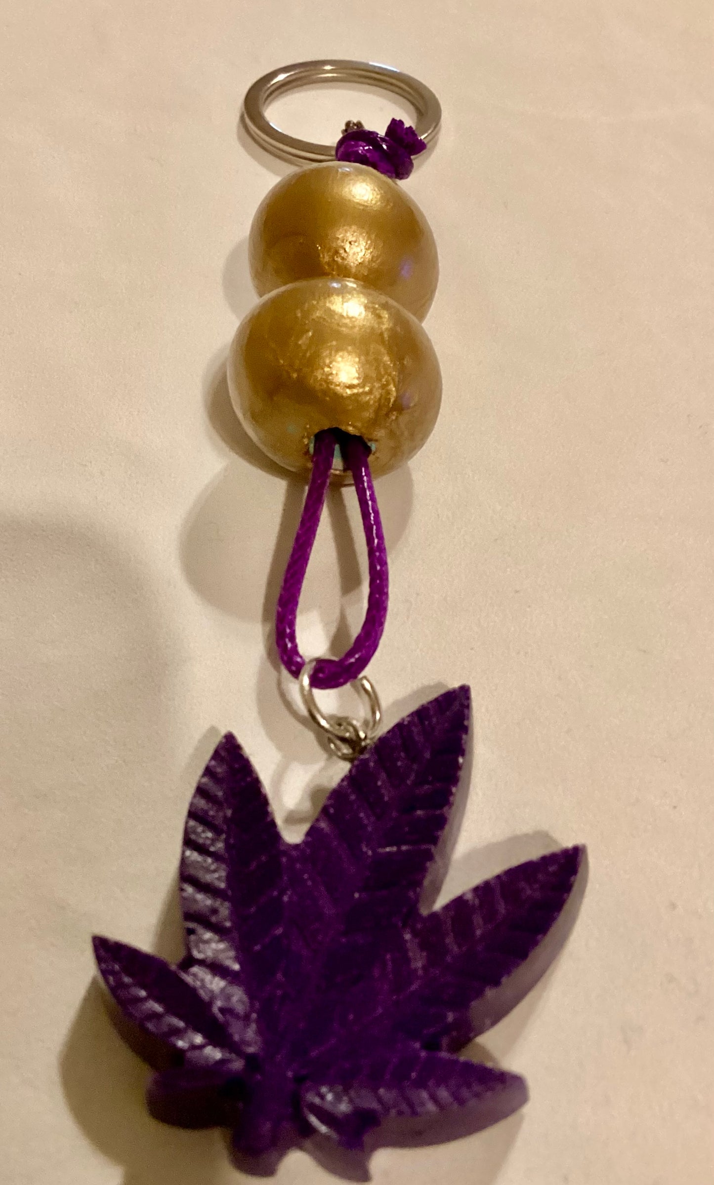 Handmade 1.5” Resin Purple Weed Leaf Medallion & Gold Wood Beaded Key Chain