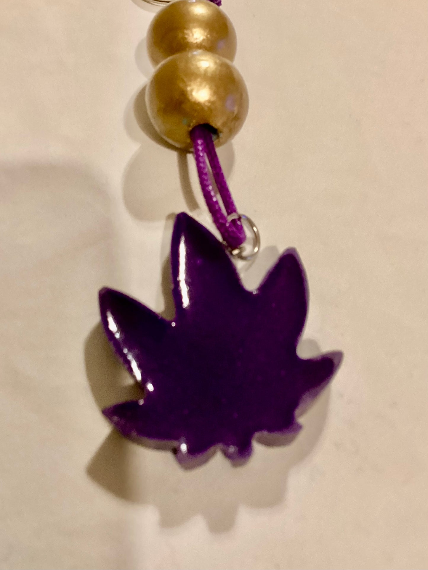 Handmade 1.5” Resin Purple Weed Leaf Medallion & Gold Wood Beaded Key Chain